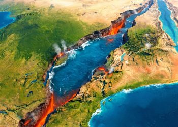 Mapa aéreo estilizado mostra uma grande fenda continental com água azul, lava exposta, fumaça vulcânica e regiões verdes e desérticas ao redor.