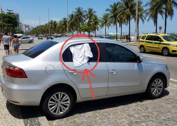 O que significa quando um motorista fixa uma flanela ou tecido branco no vidro do carro?