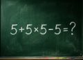 Quadro verde com a expressão matemática 5 + 5 × 5 - 5 escrita em giz branco.